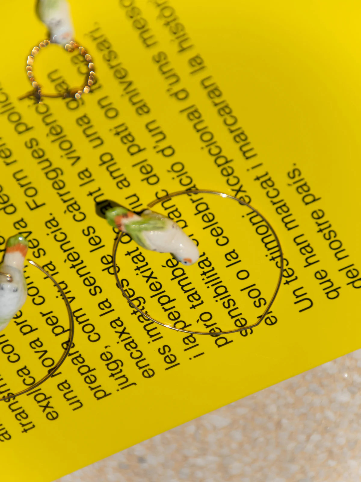 Nach White Parakeet Hoop Earrings